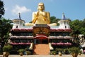 Large statue of Buddha at the entrance to a Buddhi