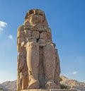 Large statue of Colossus of Memnon in Luxor Egypt