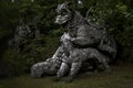 Large statue of the Dragon bitten by a lion and a dog at the famous Parco Dei Mostri in Italy