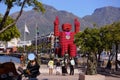 Large statue of a man made of Coca Cola Crates