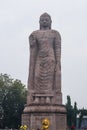 Large statue of standing Buddha in WAT THAI Temple, Sarnath city near Varanasi, India Royalty Free Stock Photo