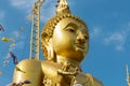 Large statues of Buddha concentrate on clouds and sky