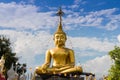 Large statues of Buddha concentrate font view on clouds and sky