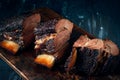 A large steaming fragrant piece of baked beef brisket on the ribs with a dark crust. Classic Texas barbecue Royalty Free Stock Photo