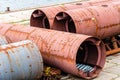 Large steel ducts and pipes rusty and abandoned in the harbour