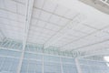 Large steel structure truss, roof frame and metal sheet in the building construction site Royalty Free Stock Photo