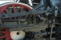 Large steel wheels of old steam locomotive red with white outline