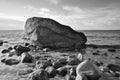 Large stone in black and white taken in the water on the beach in the sea. Danish Royalty Free Stock Photo