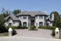 Large stone home with pillars