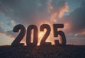 2025 in large stone letters on a rocky surface at sunset with dramatic sky Royalty Free Stock Photo
