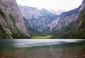 Large stone mountains in the Alps on Obersee Lake with house on shore