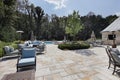 Large stone patio with swimming pool Royalty Free Stock Photo