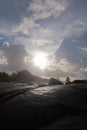 Large stone surface And the beautiful scenery of the sea and the sun light and clouds in the sky Royalty Free Stock Photo