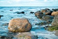 Large stone in the water on the beach in the sea. Danish coast on a sunny day Royalty Free Stock Photo