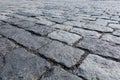 Large stones of a cobblestone paved bridge. Close-up