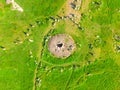 Large stones in a field with round holes in Karahunj - Armenian Stonehenge, Zorats Karer, Armenia