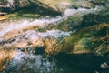 Large stones in the rugged mountain river.