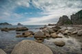 A large pile of boulders in shallow water Royalty Free Stock Photo