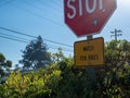 Large stop sign with notice for watch for bikes on sign