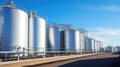 Large storage tanks and silos used for storing raw materials in an industrial facility Royalty Free Stock Photo
