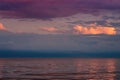 Large storm clouds on the Azov Sea, illuminated by the setting sun, the sea horizon. Royalty Free Stock Photo