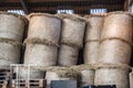 Large straw bales stacked in the warehouse Royalty Free Stock Photo