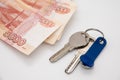 A large sum of Russian money and the keys are on the plan of the apartment. Buying a house for cash