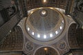 Large sunlit dome within the giant Basilica di Saint Peter i