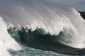 Large surf wave with barrel and wind. Royalty Free Stock Photo