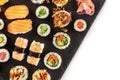 Large sushi set, close-up overhead shot on a white background with a place for text Royalty Free Stock Photo