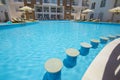 Swimming pool with bar in a luxury tropical hotel apartment resort Royalty Free Stock Photo