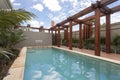 A large swimming pool at modern house backyard Royalty Free Stock Photo