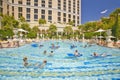 Large swimming pool with swimmers at Bellagio Casino in Las Vegas, NV