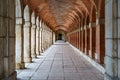 Large symmetrical exterior corridor with arches and columns in the old royal palace of Aranjuez Royalty Free Stock Photo