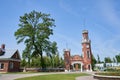 large and tall brick clock tower with blue sky background, with text space Royalty Free Stock Photo