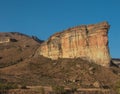 large tall cliff with sunlight on it Brandwag Buttress sandstone cliff Golden Gate Highlands National Park South Africa Royalty Free Stock Photo