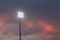 Large tall high outdoor stadium spotlights on rigid frame construction under natural sunlight. Royalty Free Stock Photo
