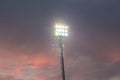 Large tall high outdoor stadium spotlights on rigid frame construction under natural sunlight. Royalty Free Stock Photo