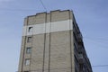 Large tall house with gray brick wall windows and balconies Royalty Free Stock Photo