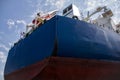 A large tanker cargo ship is being renovated and painted in shipyard dry dock Royalty Free Stock Photo