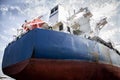 A large tanker kargo ship is being renovated and painted in shipyard dry dock Royalty Free Stock Photo