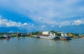 A large tanker ship is being renovated. Ship repairing on the river bank.