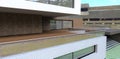 Large terrace on the roof of a modern advanced house. Terrace board covering. Wall decoration with multi-colored bricks.