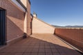 Large terrace of a single-family home on the attic floor with sloping ceilings and half of it in the shade Royalty Free Stock Photo