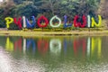 Large text with the name of the town in National Kandawgyi Botanical gardens in Pyin Oo Lwin, Myanm