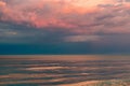 Large thunderclouds of purple on the Azov Sea, lit by the setting sun, the sea horizon. Royalty Free Stock Photo