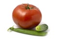 A large tomato, a small cucumber and a pod of young green peas. Fresh vegetables isolated on white background Royalty Free Stock Photo