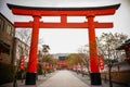 Large Torii gate with cherry tree blossom Royalty Free Stock Photo