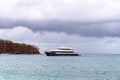 Large Tourist Catamaran Moored Offshore Ready To Pick Up Passengers