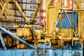 A large tower crane at a construction site against the backdrop of a modern monolithic house. Modern housing construction. Royalty Free Stock Photo